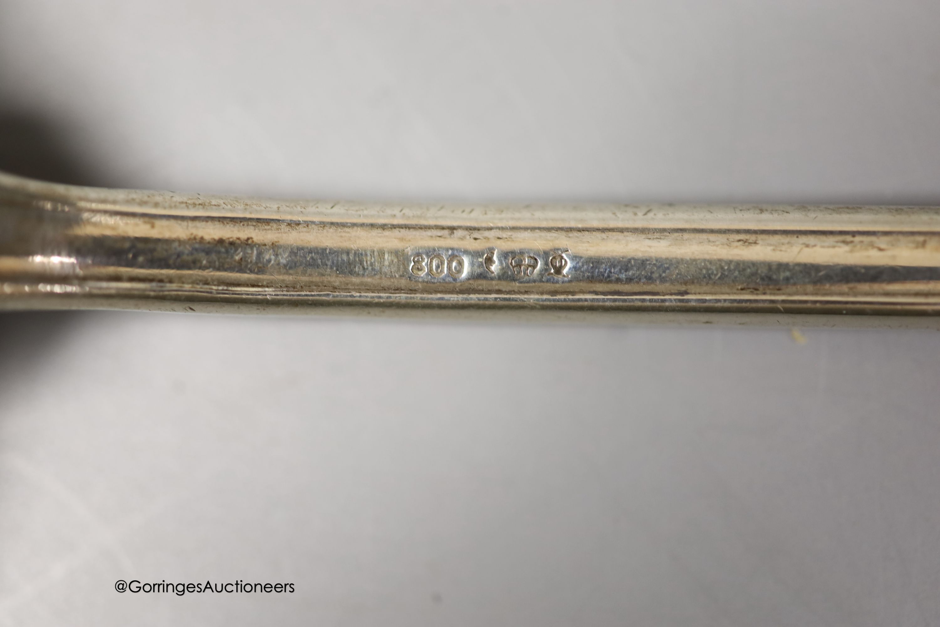 A German 800 standard white metal soup ladle, with engraved initial (a.f.), 36.7cm, gross 8oz.